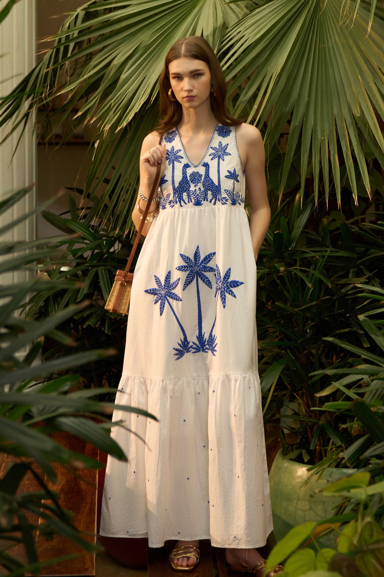 RANTHAMBORE WHITE COLOR LINEN FABRIC V-NECK SLEEVELESS MAXI BRUNCH DRESS WITH BLUE COLOR HAND EMBROIDERY