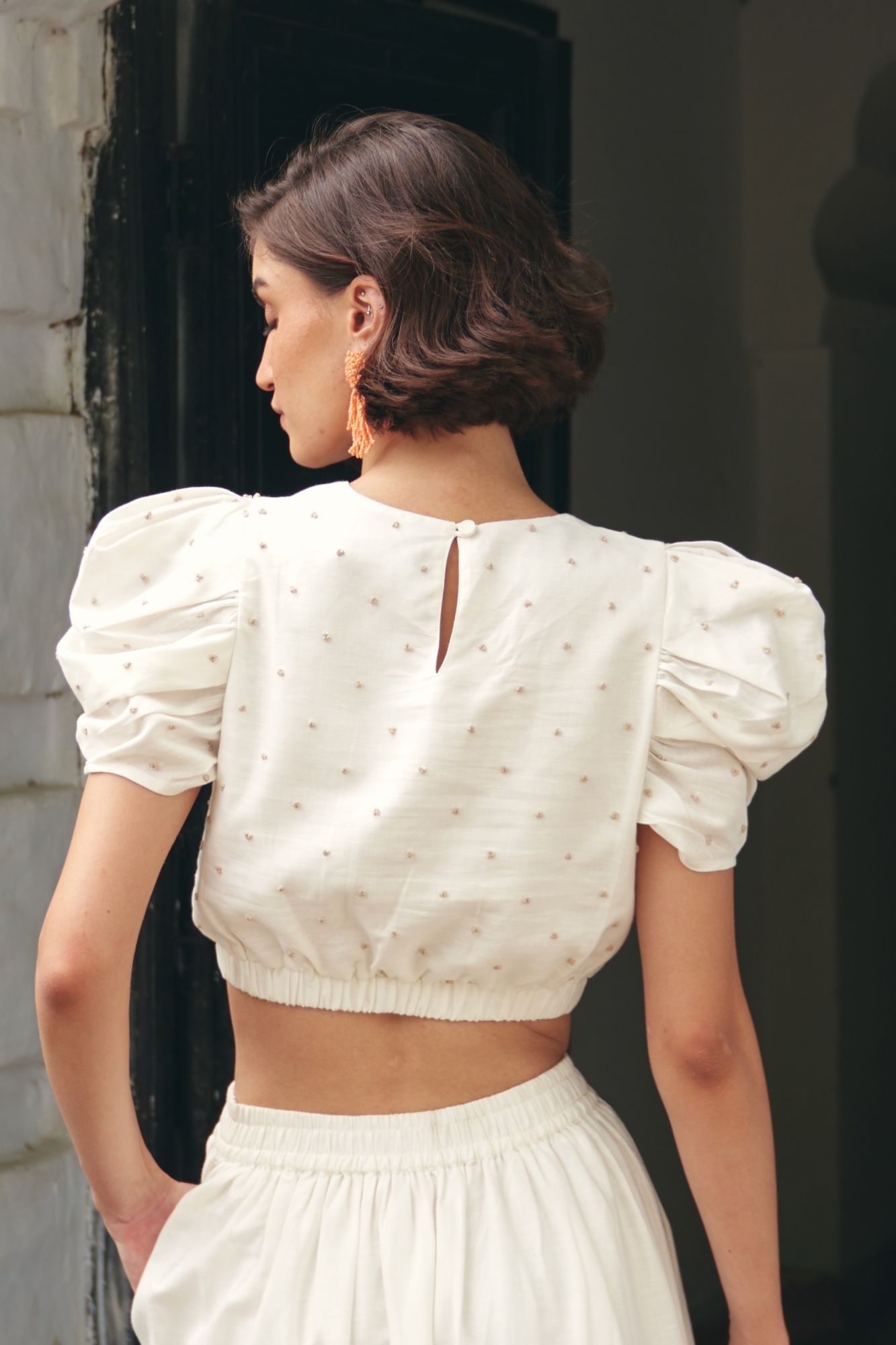 FLORENTINA OFF WHITE LINEN FABRIC CROP LENGTH SUMMER TOP WITH SLEEVES AND HAND KNOT EMBROIDERY ALL OVER