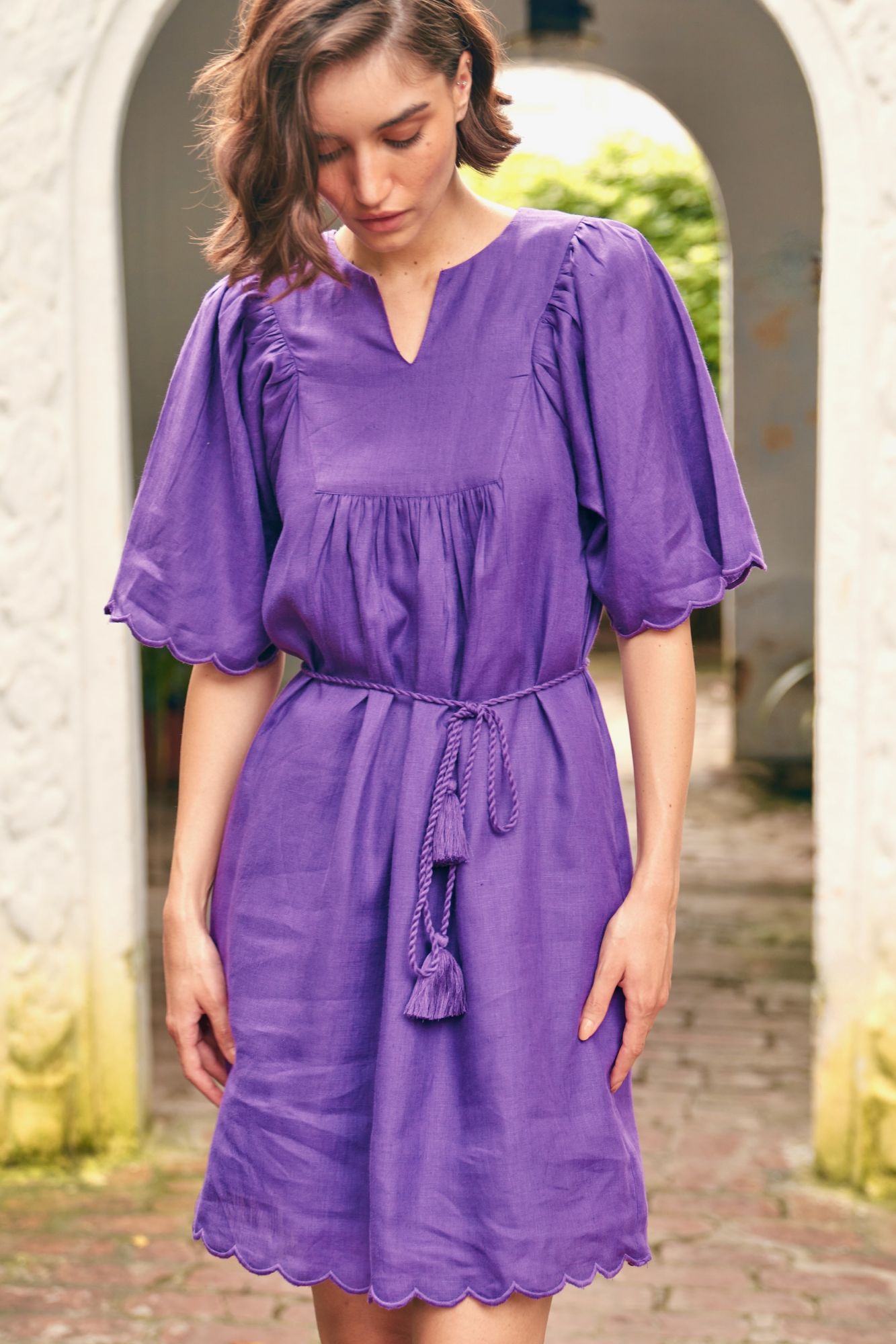 FLORENTINA SOLID PURPLE PURE LINEN FABRIC KNEE LENGTH SCALLOPED SLEEVES AND HEM SUMMER DRESS WITH WAIST SASH