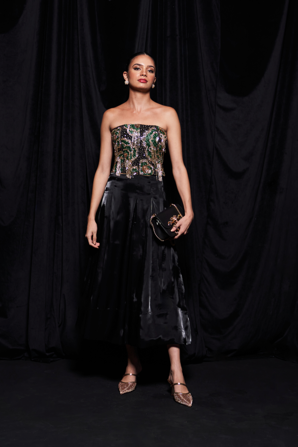 LEILA BLACK COLOR CO-ORDINATE WITH GLASS BEADS HAND EMBROIDERED CUPS BUSTIER AND FLUID ORGANZA MIDI LENGTH SKIRT