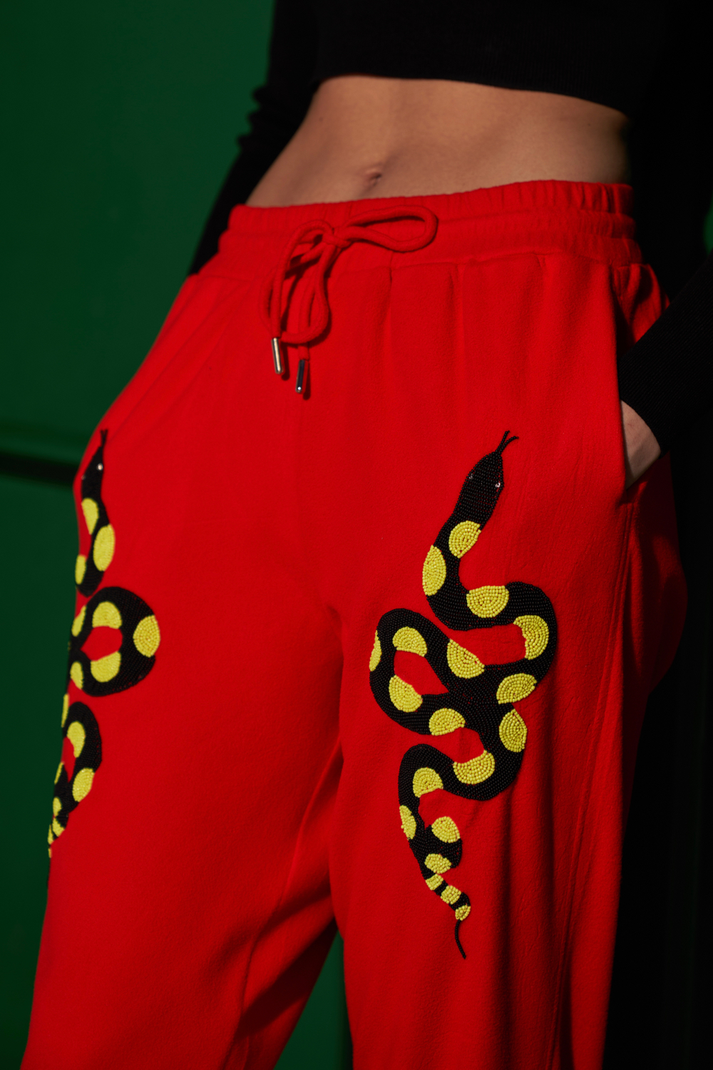 MATERIAL GIRL RED FLEECE WINTER JOGGER PANTS WITH EXCLUSIVE PYTHON HAND EMBROIDERY