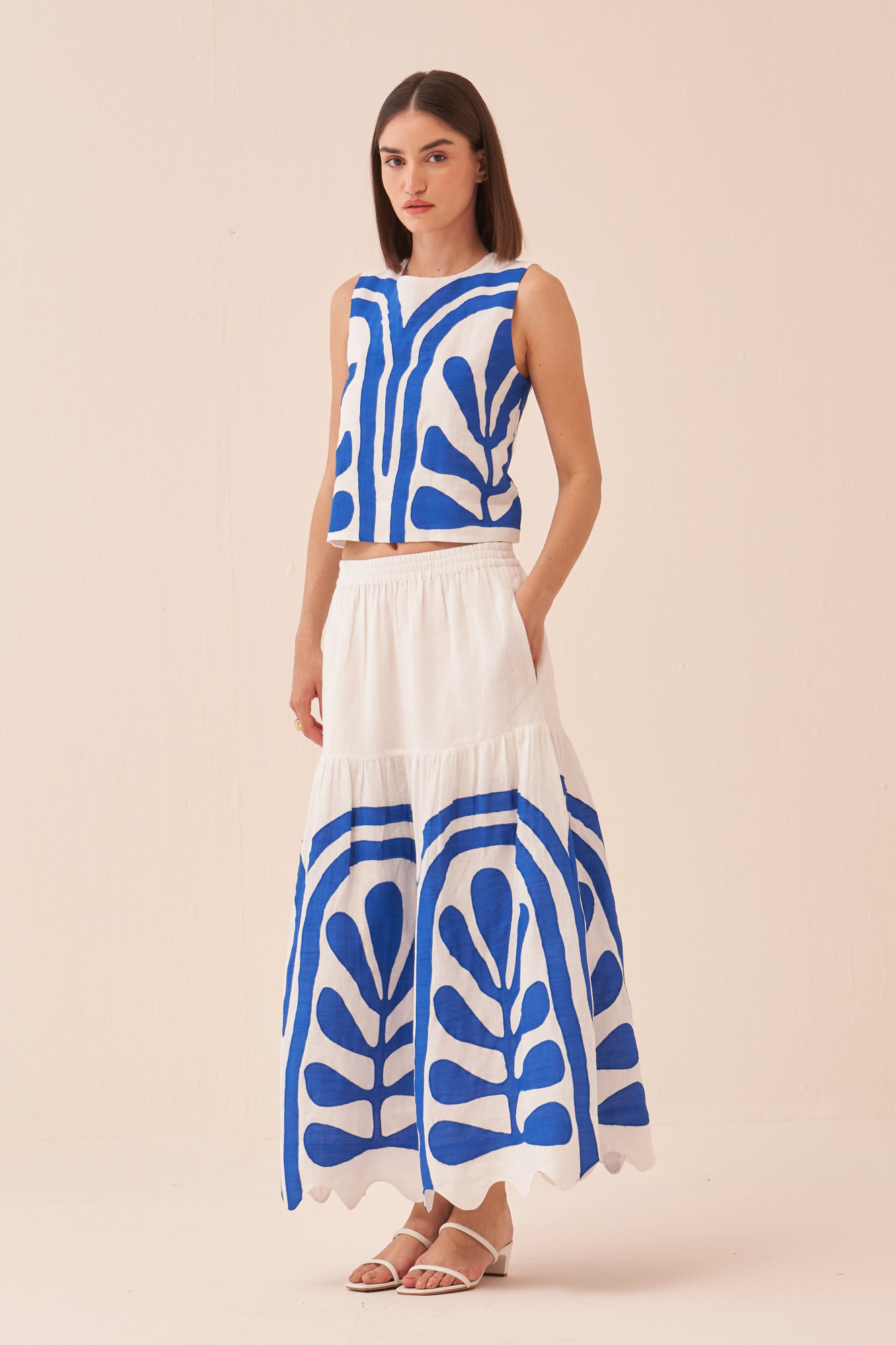 CASABLANCA WHITE COTTON LINEN MIDI LENGTH SKIRT AND SLEEVELESS TOP WITH BLUE COLOUR APPLIQUE EMBROIDERY