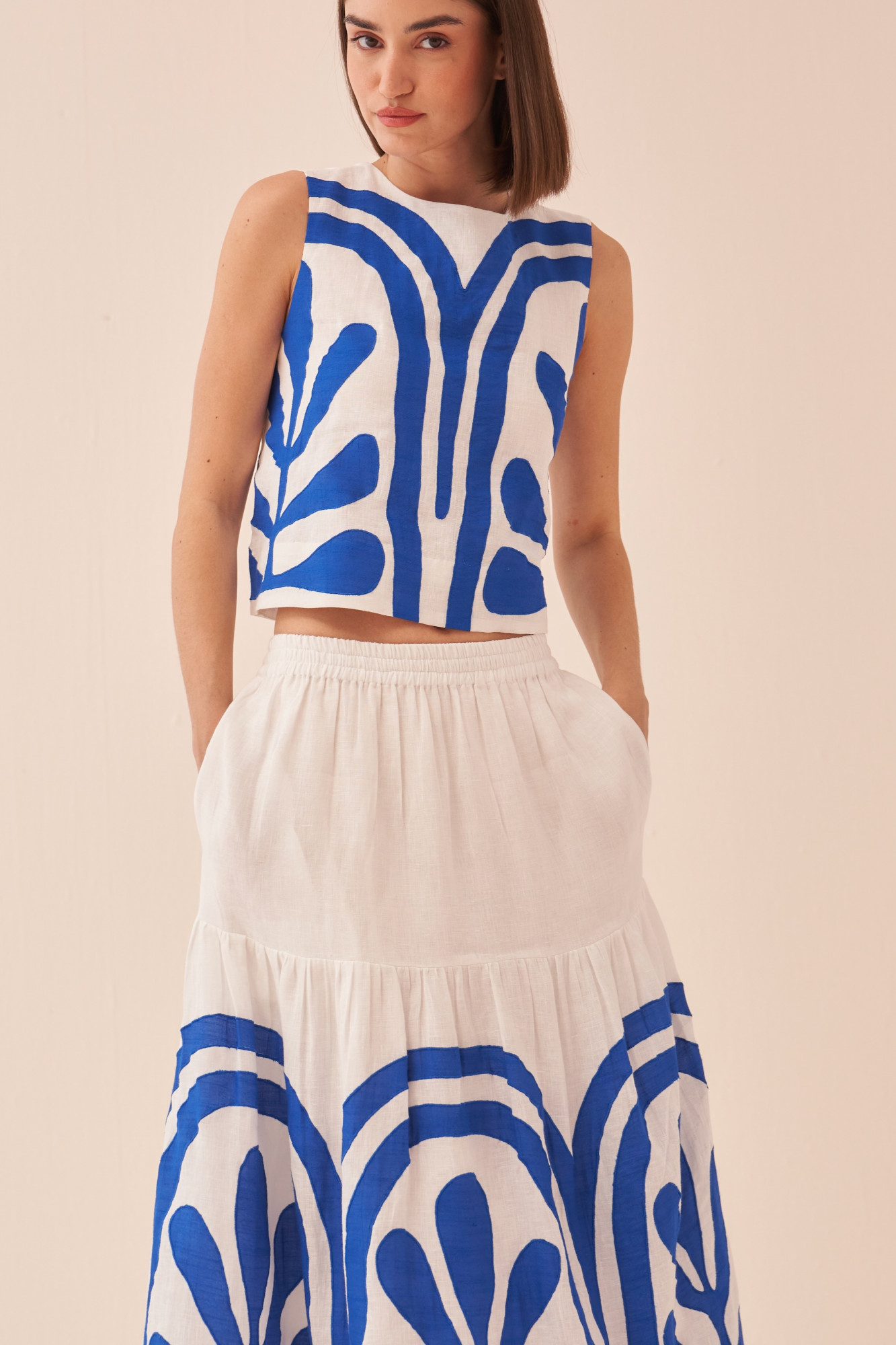 CASABLANCA WHITE COTTON LINEN MIDI LENGTH SKIRT AND SLEEVELESS TOP WITH BLUE COLOUR APPLIQUE EMBROIDERY