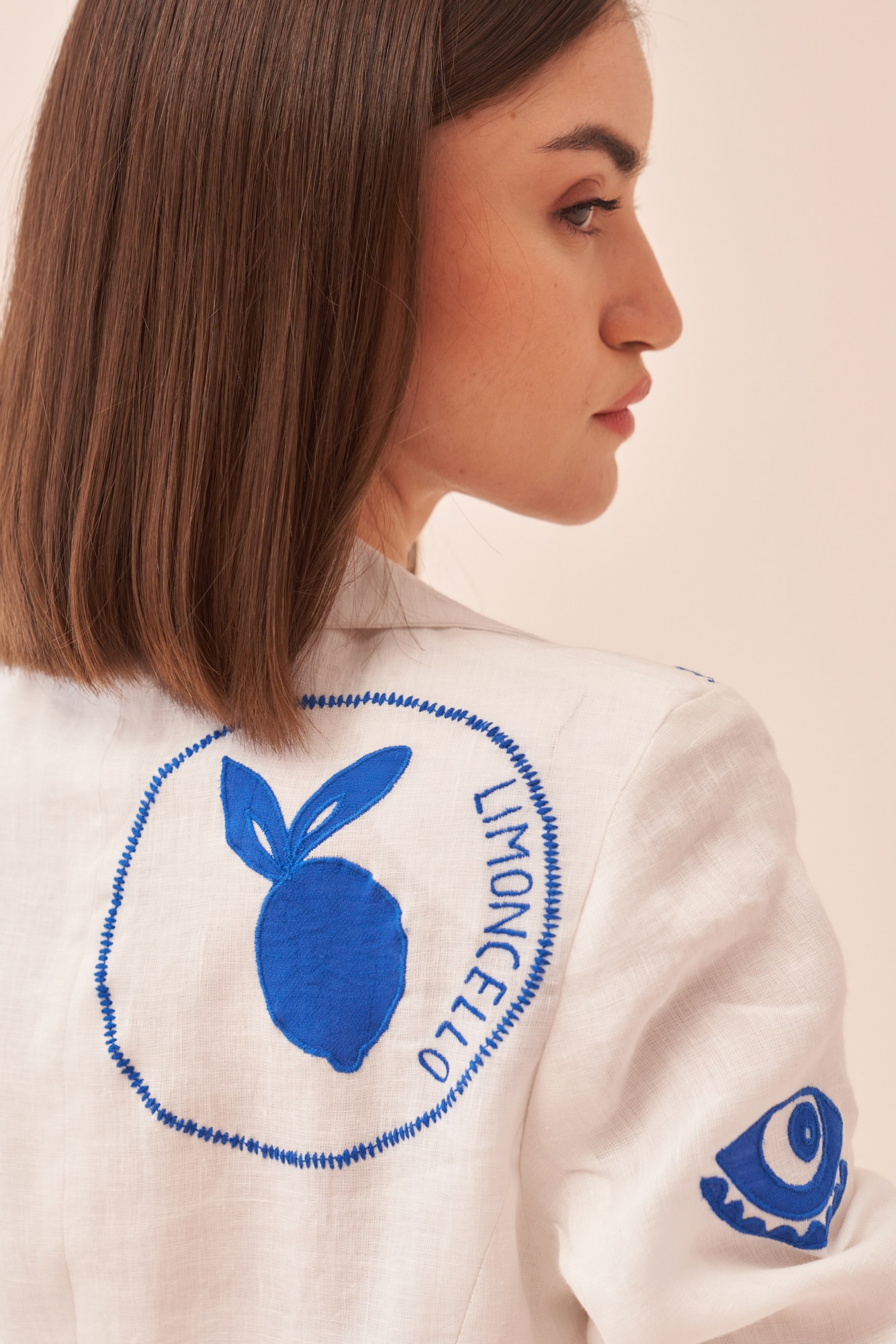 CASABLANCA WHITE COTTON LINEN JACKET AND PANT CO-ORD SET WITH BLUE COLOUR APPLIQUE EMBROIDERY