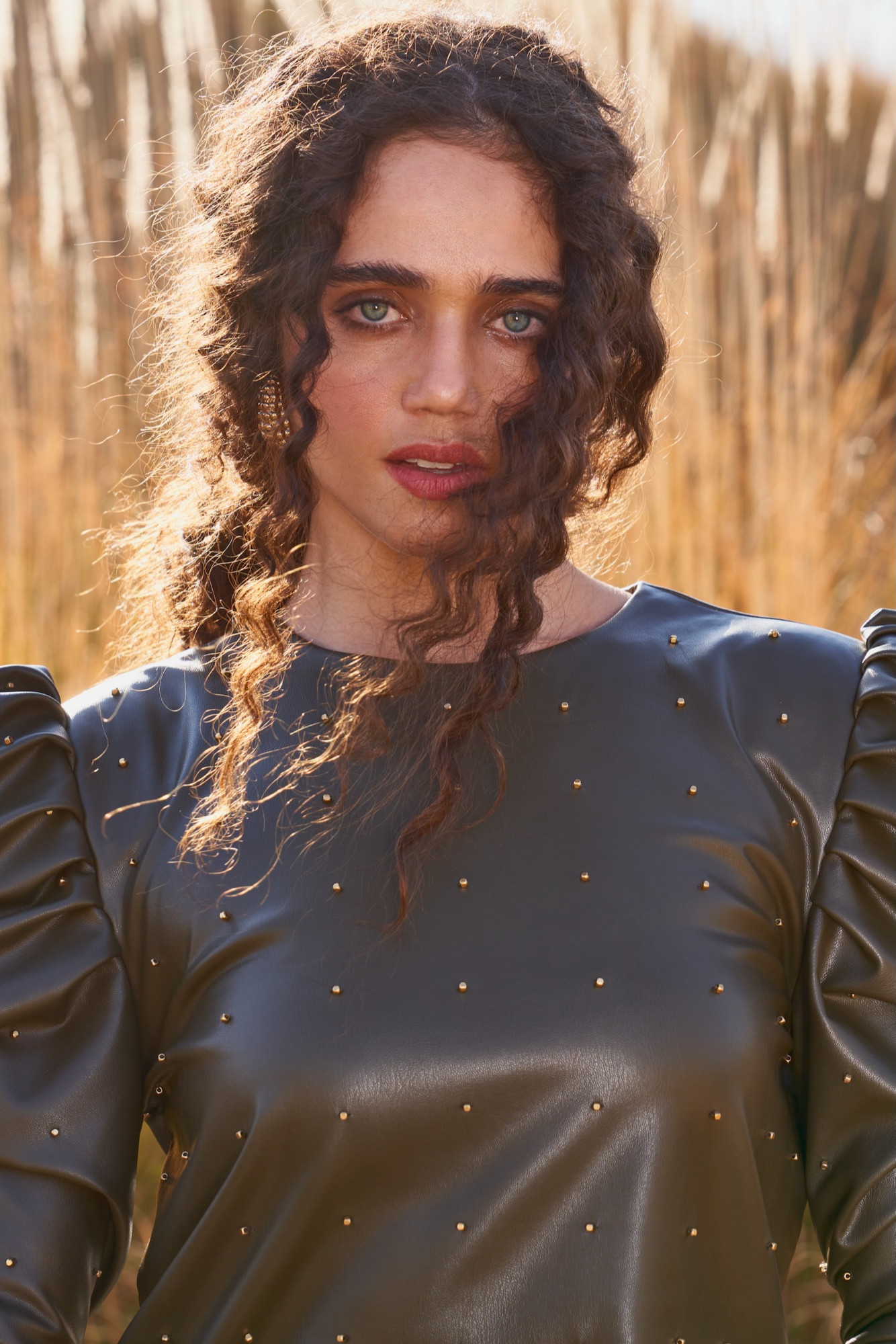 MATERIAL GIRL 03 DARK OLIVE FAUX LEATHER STUDDED PEPLUM TOP WITH FULL LENGTH SLEEVES