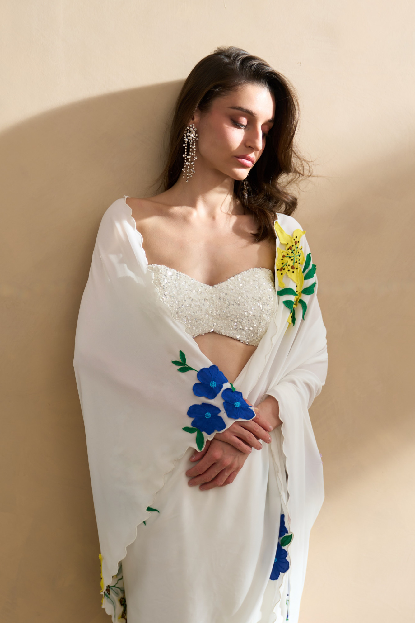 GARDEN OF SICILIA WHITE SARI WITH DELICATE FLORAL EMBROIDERY AND FULLY SEUINED BUSTIER BLOUSE