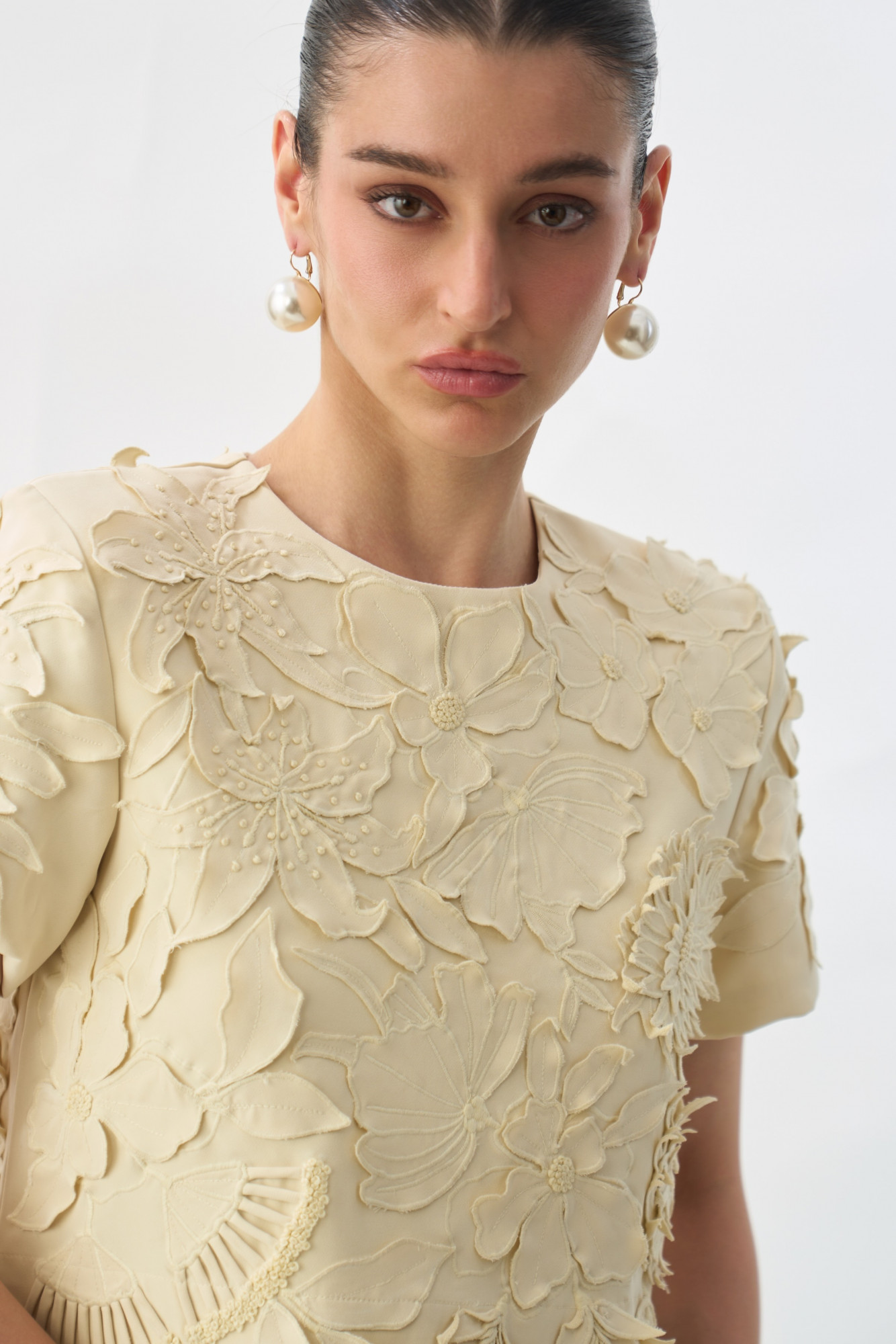 GARDEN OF SICILIA CREAM COLOUR CROP LENGTH STATEMENT TOP WITH DELICATE FLORAL EMBROIDERY