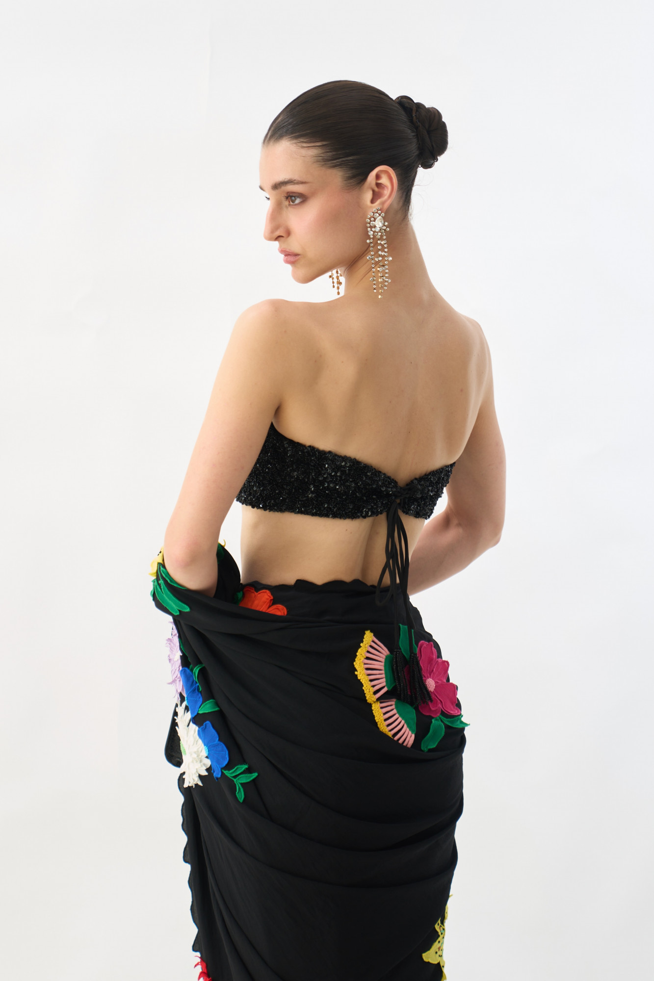 GARDEN OF SICILIA BLACK COLOR SARI WITH FLORAL EMBROIDERY ALL OVER AND FULLY SEQUINED BUSTIER BLOUSE