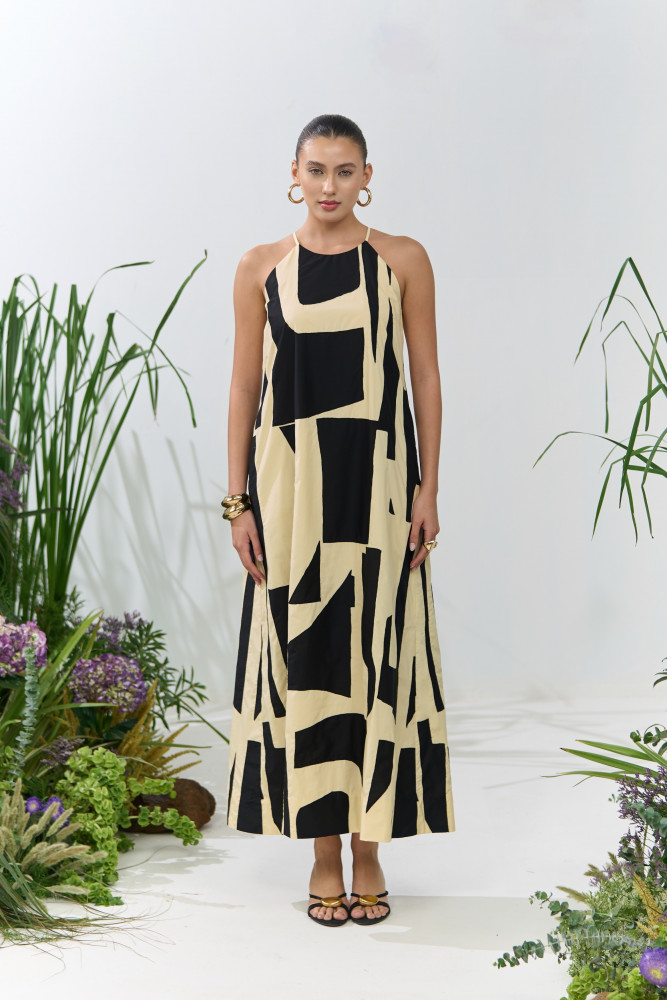 Image of ATELIER RIVIERA BUTTERMILK COLOR POPLIN HALTER CUT MAXI DRESS WITH BLACK FABRIC PATCH WORK