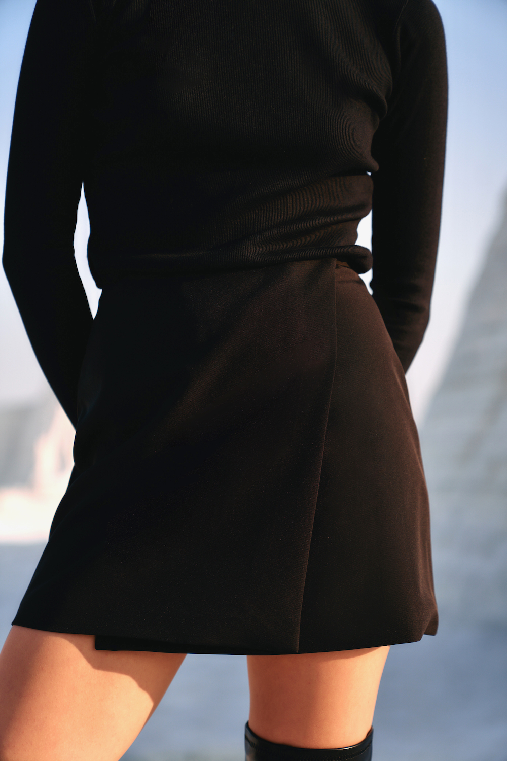 MATERIAL GIRLS O2 JADE BLACK COLOR SHORT LENGTH WRAP SKIRT WITH CONCEALED BUTTON OPENING