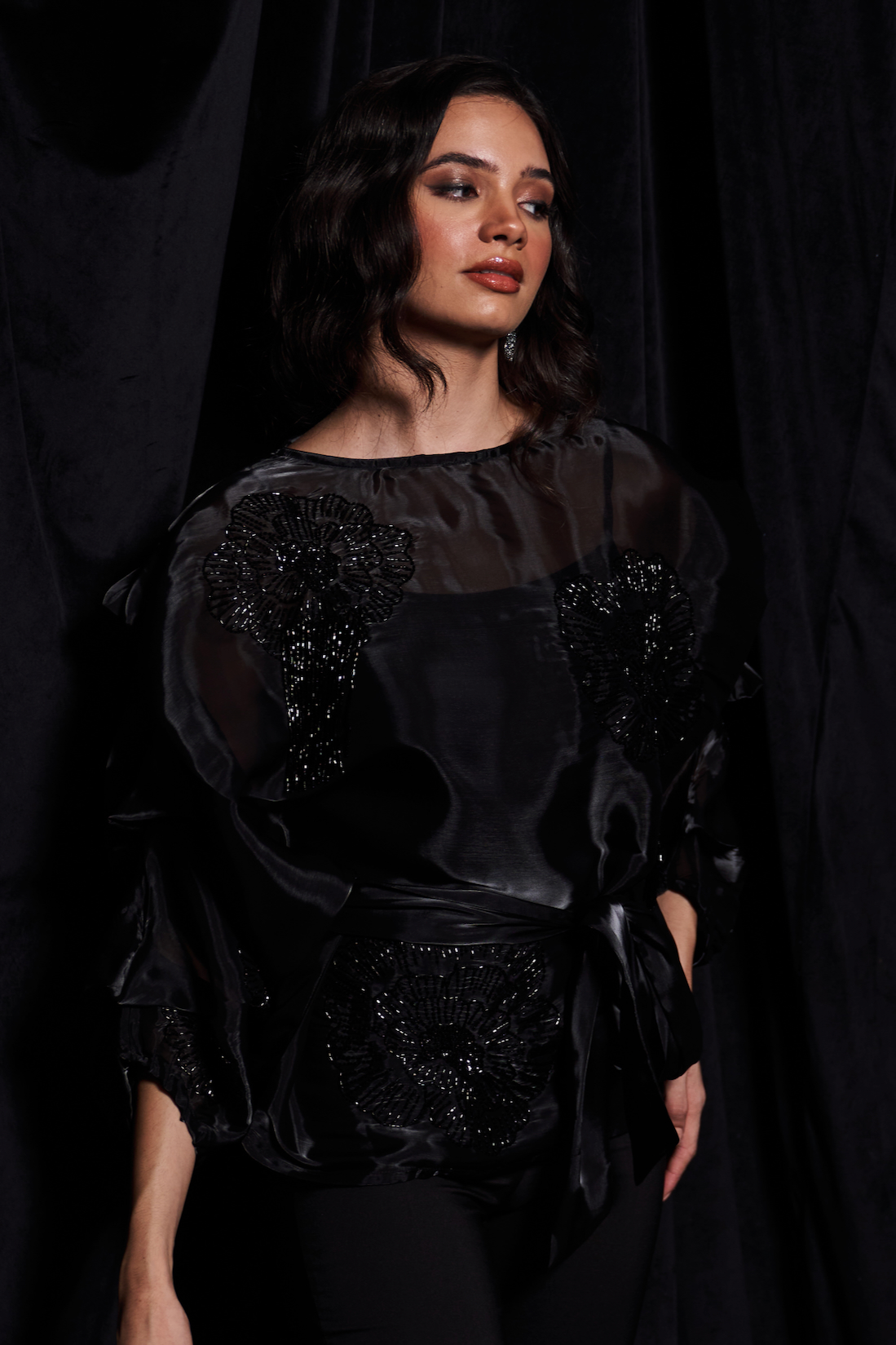 LEILA BLACK COLOR FLUID ORGANZA TOP WITH GLISTENING BLACK GLASS BEADS EMBROIDERY WORK AND WAIST SASH