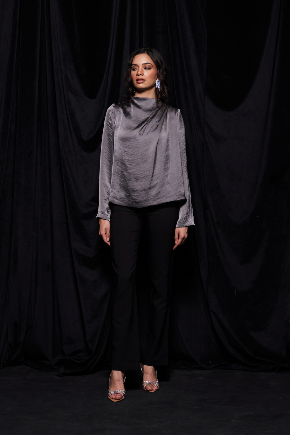 LEILA TANNED SILVER COLOR TEXTURED SATIN WAIST LENGTH LONG SLEEVES TOP WITH PLEAT DETAILING AND ZIP OPENING AT THE BACK