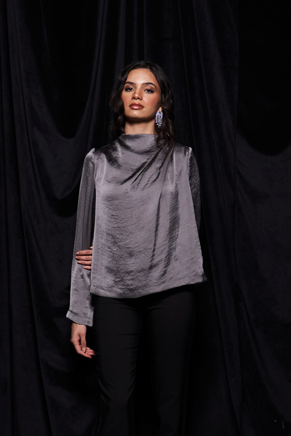 LEILA TANNED SILVER COLOR TEXTURED SATIN WAIST LENGTH LONG SLEEVES TOP WITH PLEAT DETAILING AND ZIP OPENING AT THE BACK