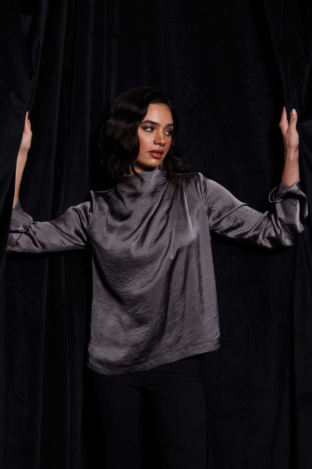 LEILA TANNED SILVER COLOR TEXTURED SATIN WAIST LENGTH LONG SLEEVES TOP WITH PLEAT DETAILING AND ZIP OPENING AT THE BACK