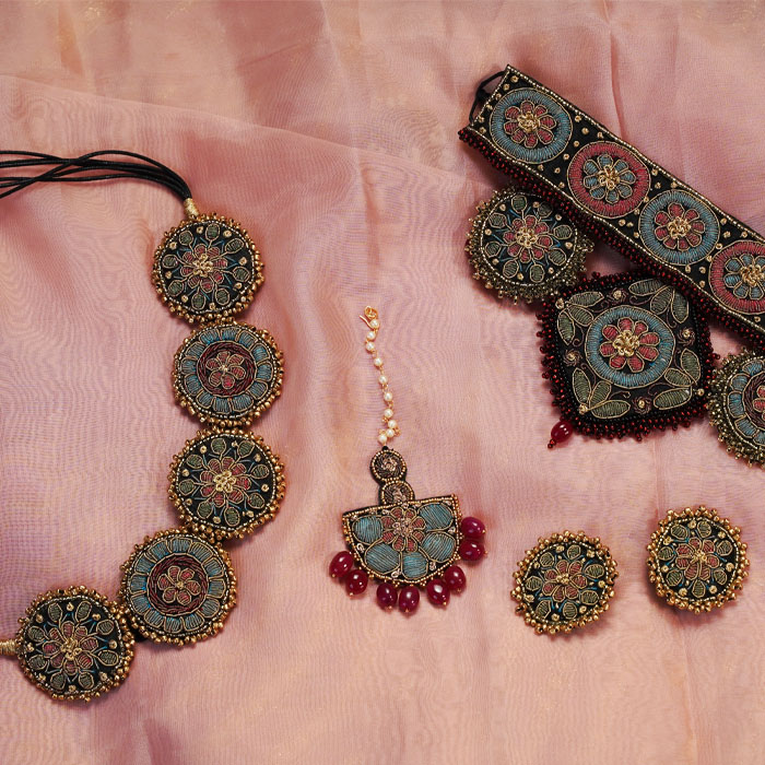 Moirra handcrafted bestsellers featuring Meerabai choker, Rani Haar elements, earrings, and maang tika with zardozi embroidery.