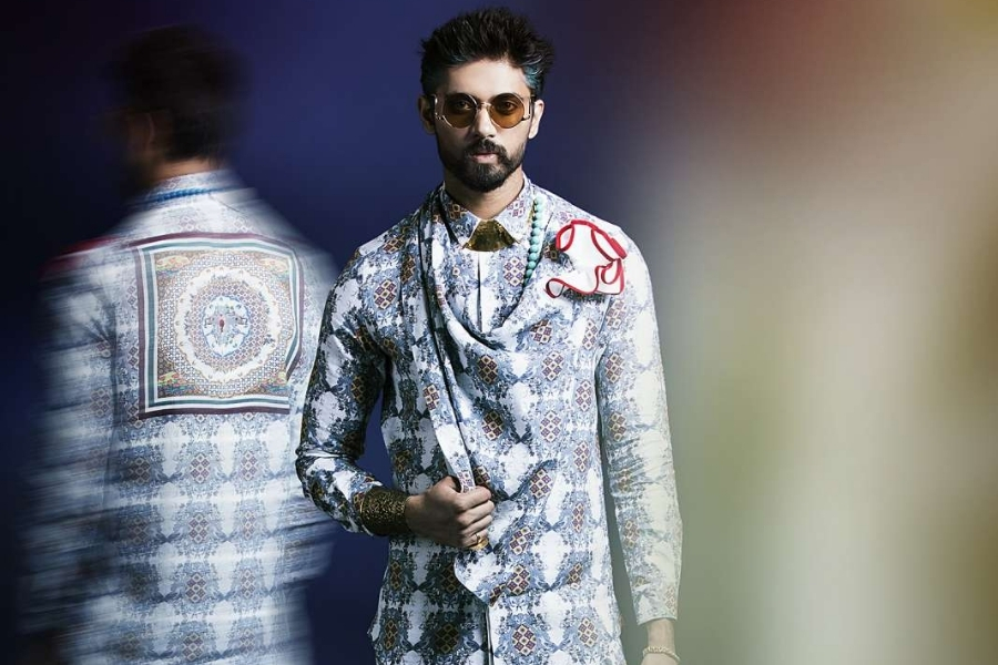 Ajay Kumar showcases vibrant, print-led menswear at Lakmé Fashion Week 2015, redefining seasonal dressing with bold motifs, colourful palettes and contemporary silhouettes on the GenNext runway.