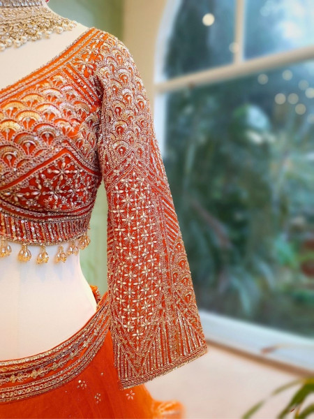 Lustre Enchant Orange Net Lehenga with Heavy Embroidered Blouse