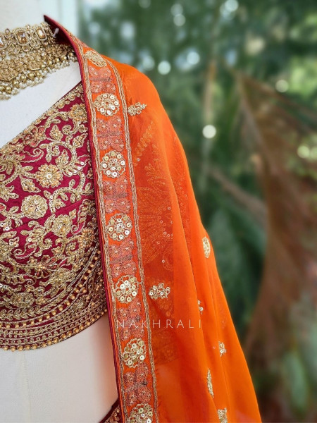 Ishira Orange Embroidered Lehenga with Maroon Blouse