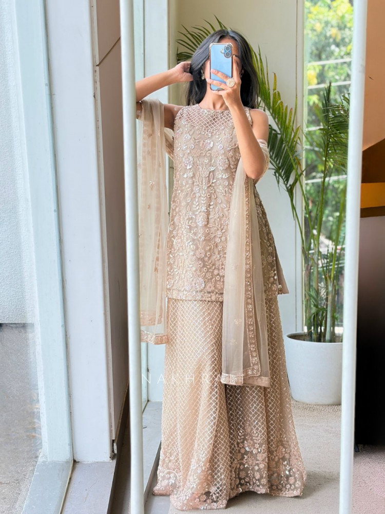 Image of Melovia Beige Net Sharara Suit Set with Floral Sequin Work