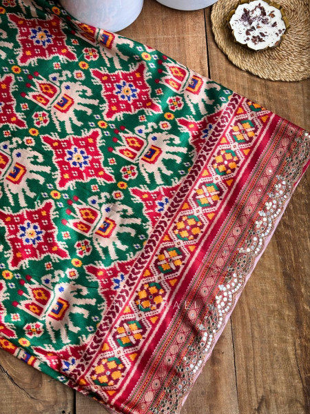 Aarini Green Patola Print Saree with Mirror Work Border