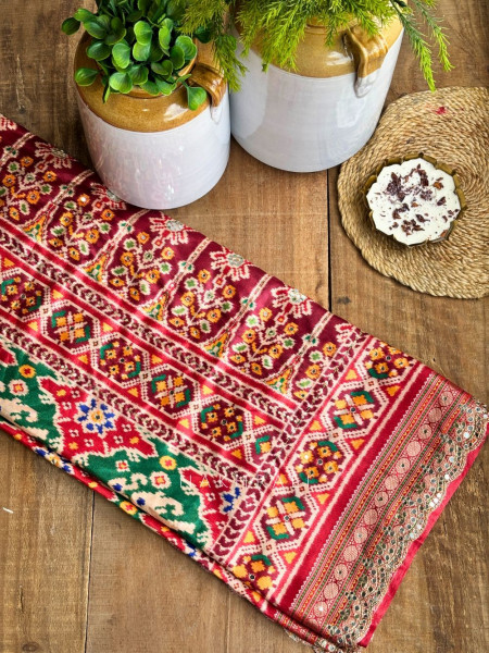 Aarini Green Patola Print Saree with Mirror Work Border