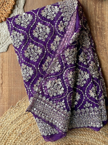 Tarangini Purple Net Saree With Cutdana and Sequin Work