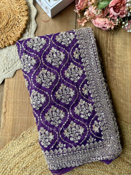 Tarangini Purple Net Saree With Cutdana and Sequin Work