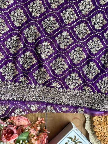 Tarangini Purple Net Saree With Cutdana and Sequin Work