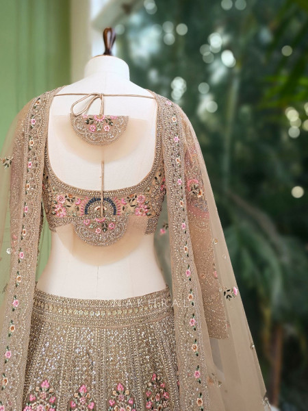 Rukmira Gold Bridal Lehenga with Floral Embroidery