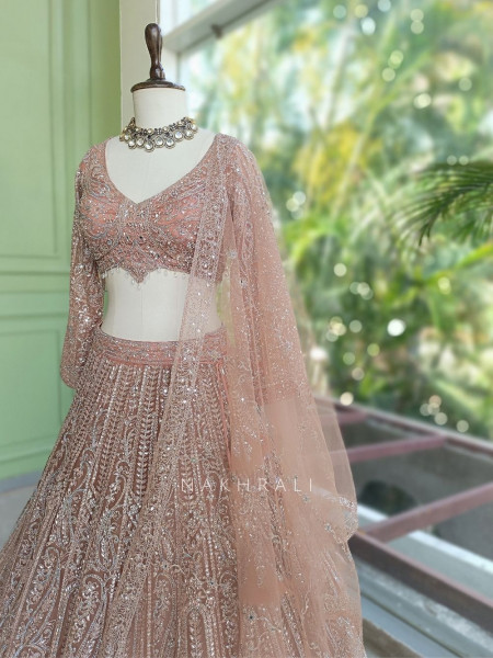 Venoora Peach Bridal Lehenga with Zari and Sequin Work