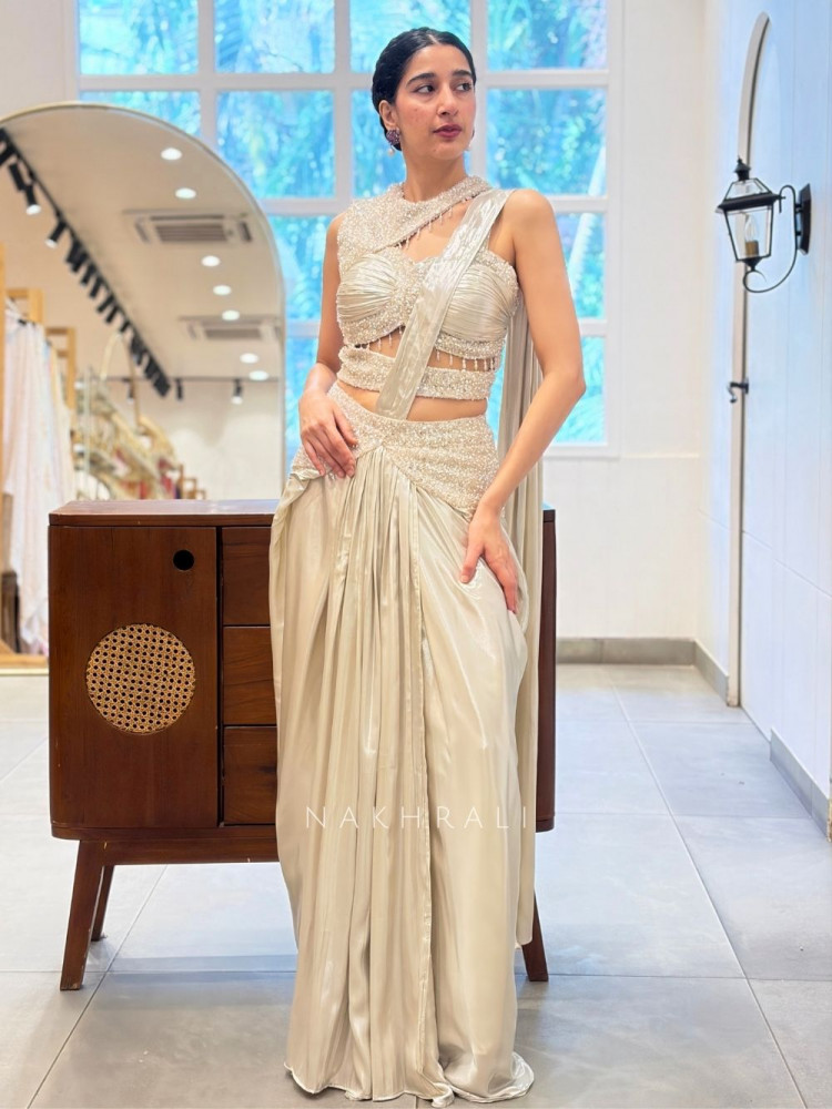 Image of Luminary Off White Satin Blend Drape Saree with Corset Blouse – Bead, Sequin &amp; Cutdana Work