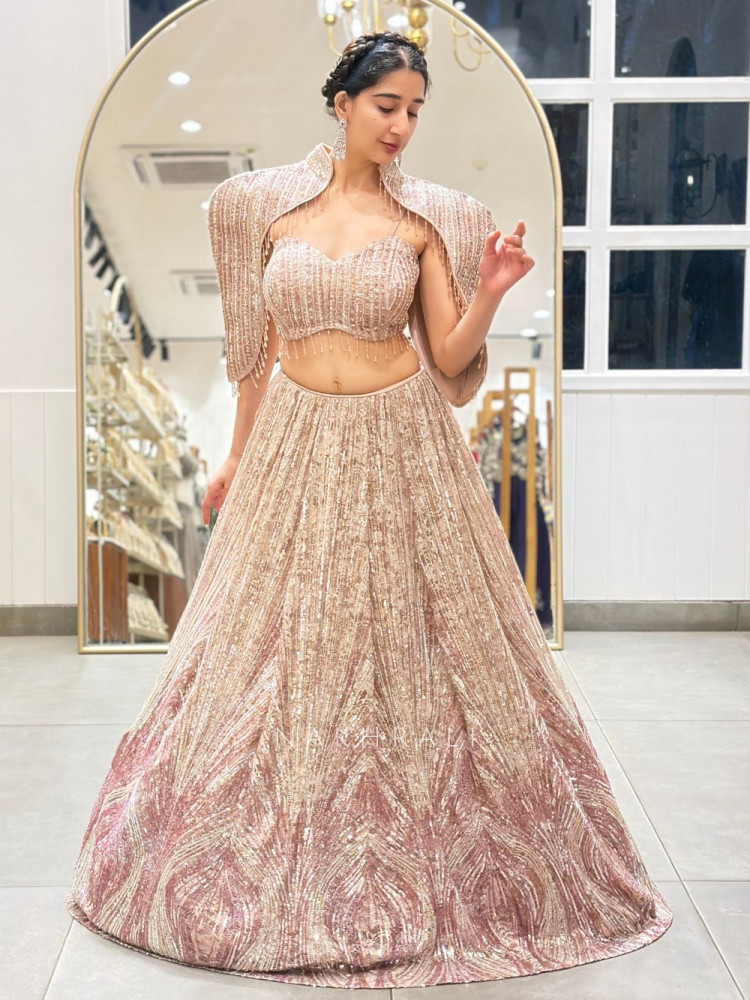 Image of Prismora Peach Net Indo Western Lehenga Set with Sequin Cape and Crystal Tassels