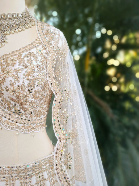 Ravya Cream Mirror and Beads Work Lehenga Set