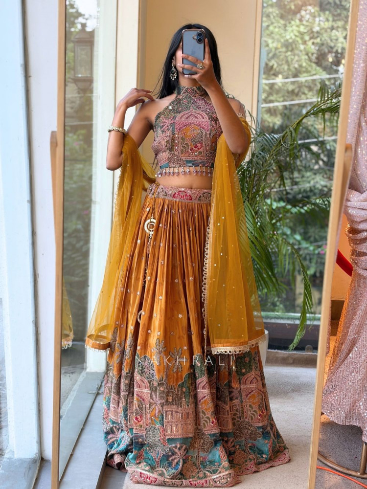 Image of Jharokha Tales Yellow Lehenga with Pichwai-Inspired Embroidery