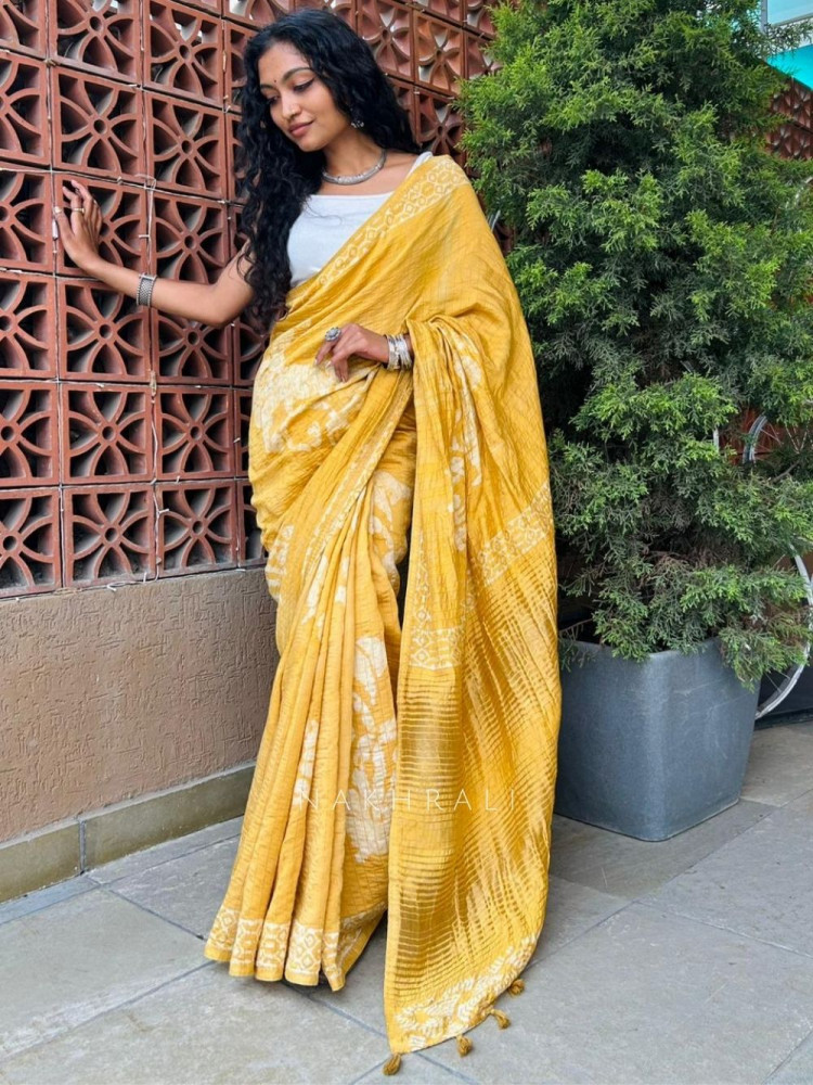 Image of Shubhta Yellow Batik Printed Saree with Tassel Pallu