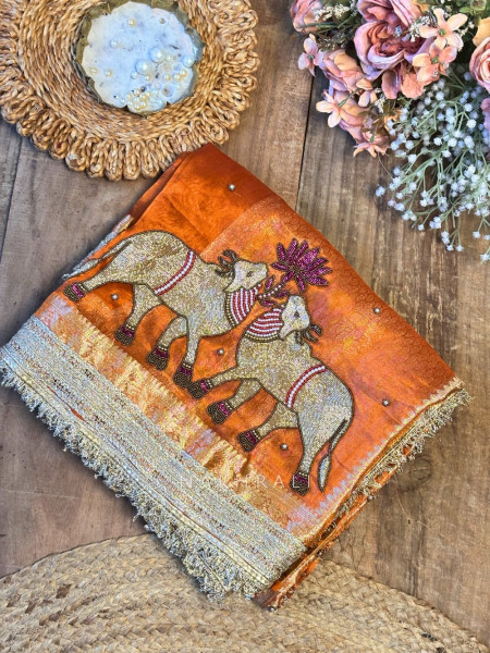 Vraj Ras Orange Banarasi Tissue Silk Saree – Hand Embroidery & Zari Border