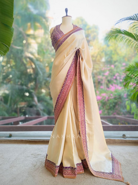 Nazara Off white Satin Saree with Embroidered Sequin Blouse