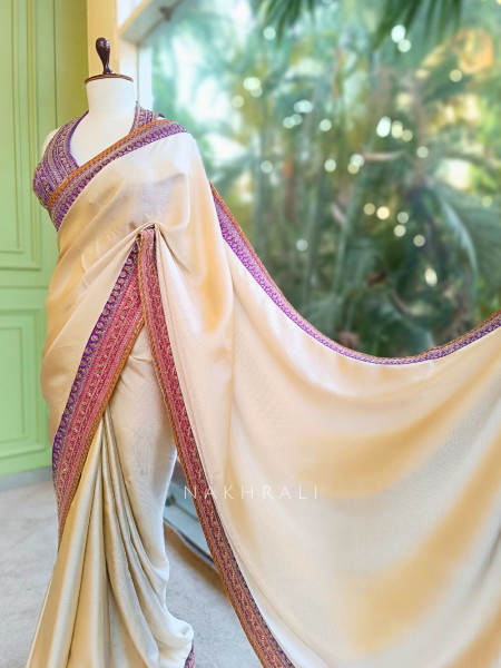 Nazara Off white Satin Saree with Embroidered Sequin Blouse