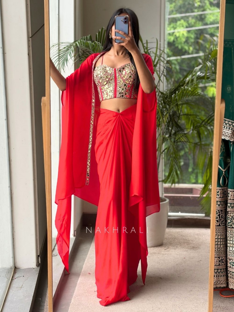 Image of Glimmering  Red Georgette Crop Top Dhoti Skirt Set with Cape