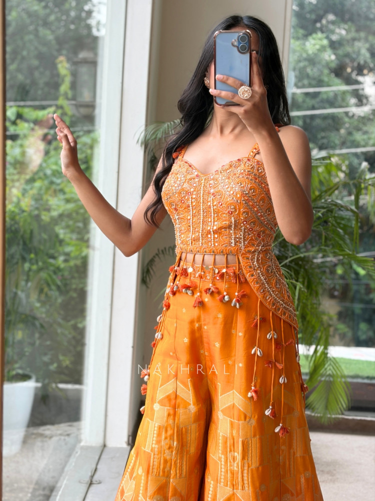 Image of Tangerine Orange Banarasi Brocade Sharara Set with Cowrie Shell Blouse