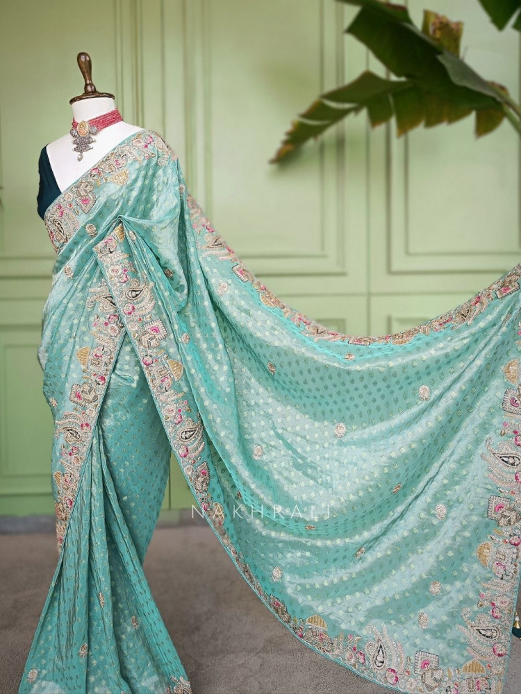 Image of Mrig-sangam Firozi Tissue Saree with Hand Embroidered Paisley Border