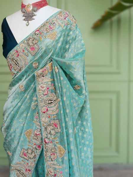 Mrig-sangam Firozi Tissue Saree with Hand Embroidered Paisley Border