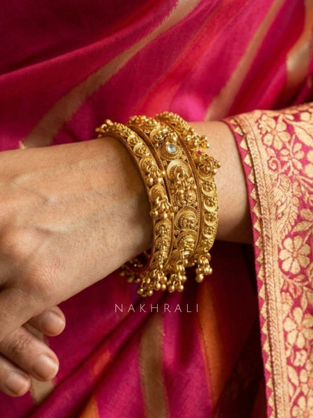 Hemvritta Golden Bangle Set With Temple Motif and Beaded Fringe Detail