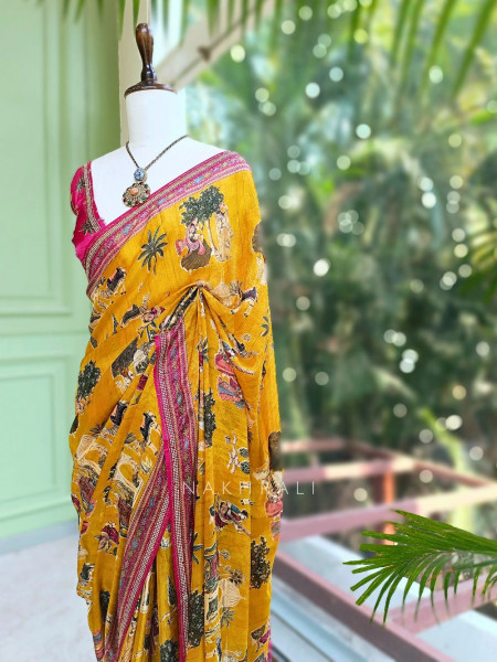 Nerix Mustard Printed Saree with Scenic Motif Border
