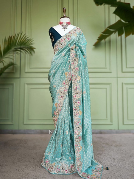 Mrig-sangam Firozi Tissue Saree with Hand Embroidered Paisley Border