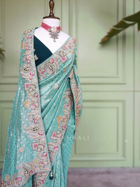 Mrig-sangam Firozi Tissue Saree with Hand Embroidered Paisley Border