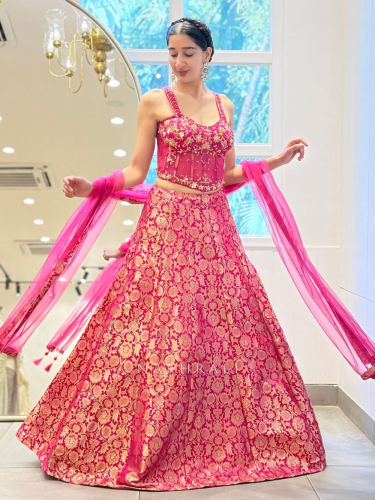 Image of Gul-Shan Magenta Banarasi Brocade Corset Lehenga with Cut Dana Work