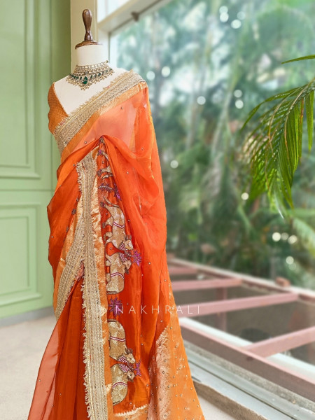 Vraj Ras Orange Banarasi Tissue Silk Saree – Hand Embroidery & Zari Border