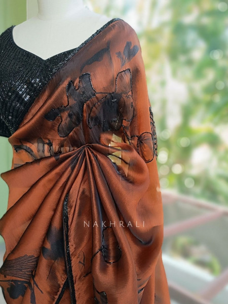 Glittering Brown Organza Silk Saree with Abstract Floral Peacock Cutdana Work