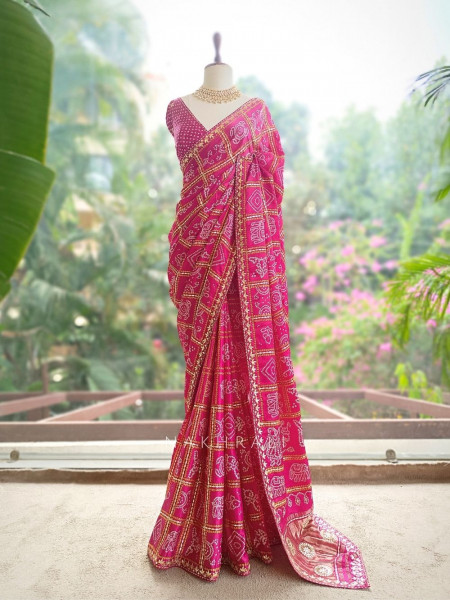 Rangsheesh Magenta Bandhani Saree with Heritage Border